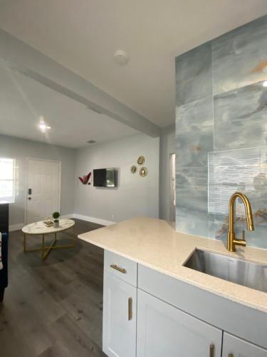 a kitchen with a sink and a counter top at Bella Breeze in Sanford