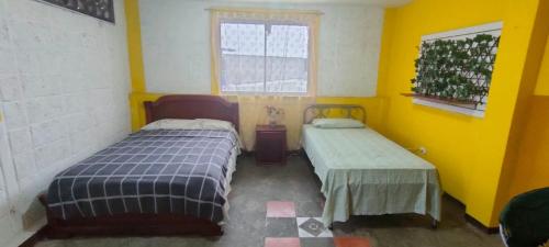 Cama o camas de una habitación en Galo Residencial
