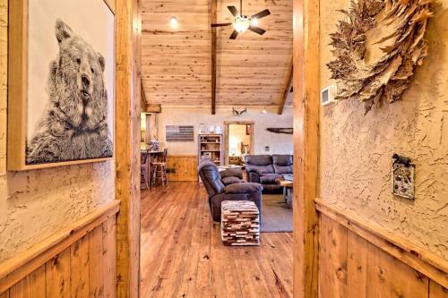 a living room with a couch and a table at Ruby River Lodge in Ellijay