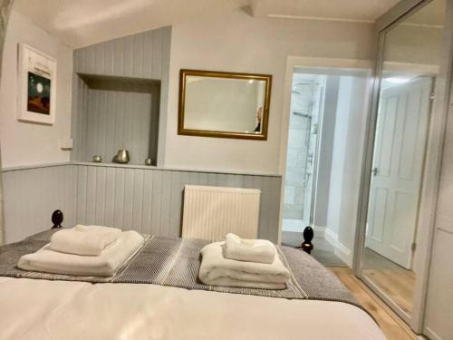 Postel nebo postele na pokoji v ubytování Vine Cottage
