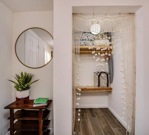 a dressing room with a mirror and a table at JT Cottage in Yucca Valley