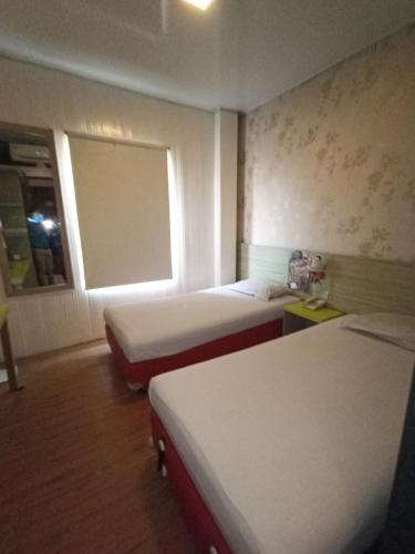 Postel nebo postele na pokoji v ubytování Hotel Aleander