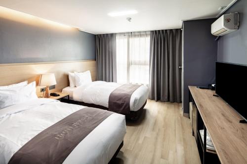 Voodi või voodid majutusasutuse Hotel Bernoui Seoul toas