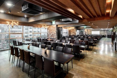 a dining room with tables and chairs at Hotel Bernoui Seoul in Seoul