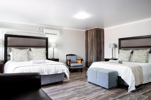 Llit o llits en una habitació de Villa Gracia Guesthouse