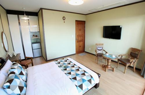 Postel nebo postele na pokoji v ubytování Hodo House