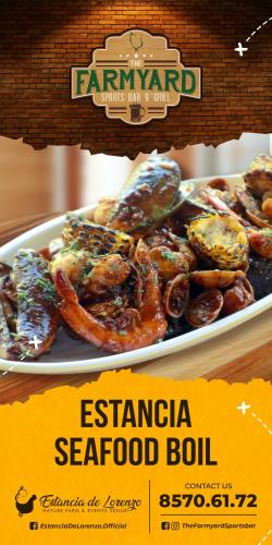 a plate of food with seafood on a table at Estancia de lorenzo in San Mateo