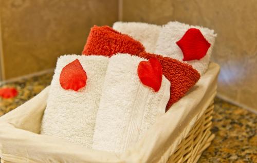 a pile of towels in a basket on a counter at Watermark Apartments in Whitby