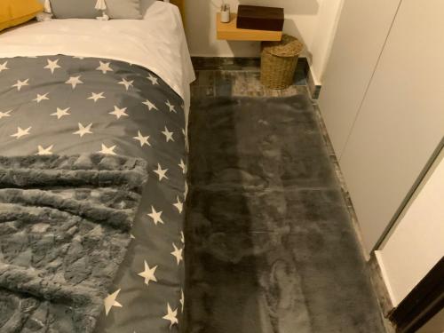 a bedroom with a bed with an american flag blanket at Pelion 7 Lives in Tsagarada