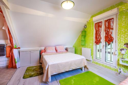a small room with a bed and a window at cavalibre-mesquer in Mesquer