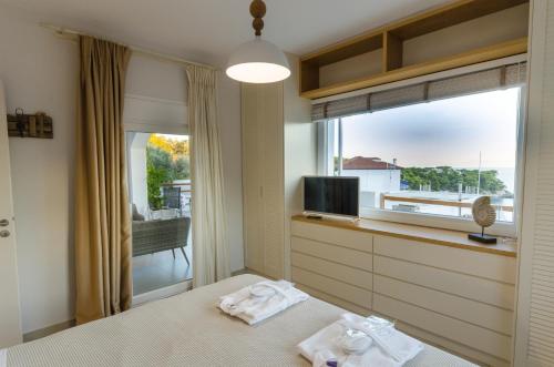 Ένα ή περισσότερα κρεβάτια σε δωμάτιο στο Aegean Suites