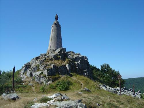 a lighthouse on top of a mountain with rocks at Appartemment situé a lacaune les bains in Lacaune