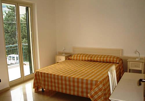Una cama o camas en una habitación de Appartamenti Pirrera