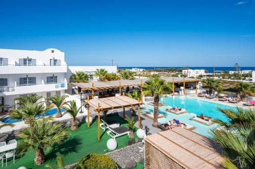 an aerial view of a resort with a swimming pool at Smy Mediterranean White Santorini in Kamari