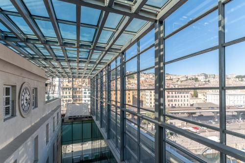a view from the top of a building with glass windows at Hotel Astoria in Genova