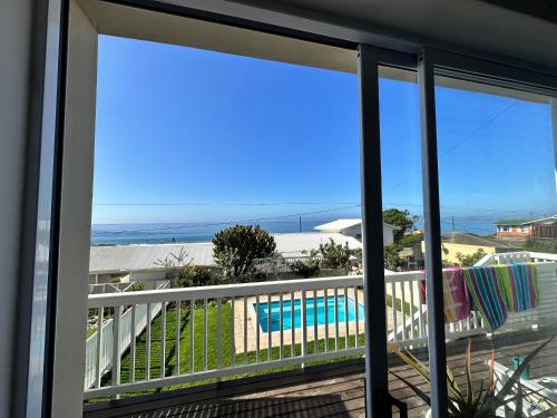 a view of the pool from the balcony of a house at Allalapstix in Reebok