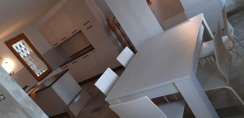 an overhead view of a white staircase in a house at Casa ORI in Perledo