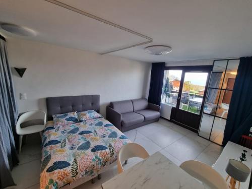 Ένα ή περισσότερα κρεβάτια σε δωμάτιο στο le 20