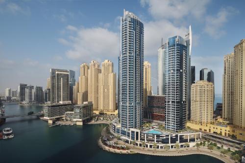 a large body of water with tall buildings at InterContinental Dubai Marina, an IHG Hotel in Dubai