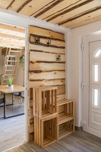 a wooden wall in a room with a door at Apartments Keber in Ljubljana