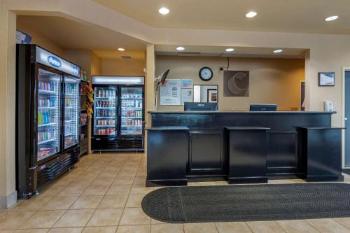 a bar in a grocery store with a drink cooler at Comfort Inn Sturgeon Falls in Sturgeon Falls