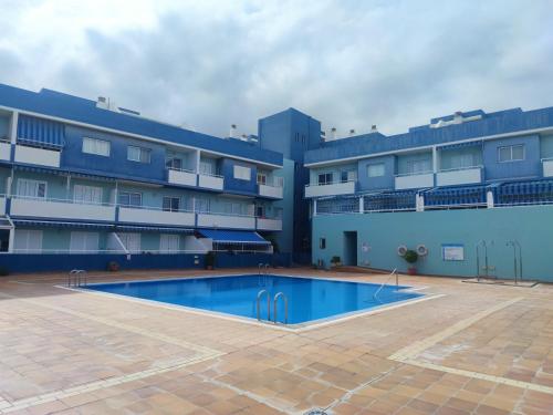 a view of the courtyard of a building with a swimming pool at BLUE Home in Puertito de Güímar