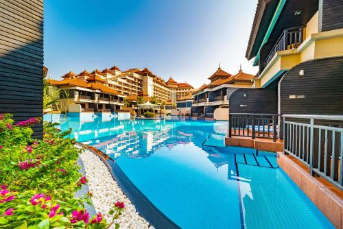 a view of a swimming pool at a resort at EDEN'S Homes & Villas - Anantara The Palm Residences in Dubai