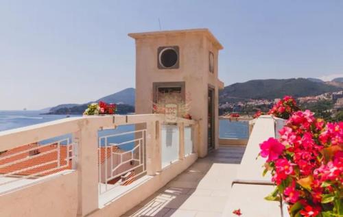 a view of a building with flowers on a balcony at Workation Panorama Escape in Budva