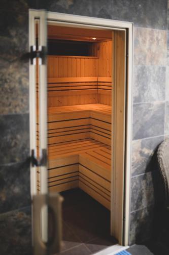 an open door to a sauna in a room at Malmaison Birmingham in Birmingham