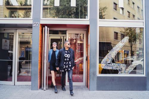a man and a woman standing in front of a store at Generator Barcelona in Barcelona