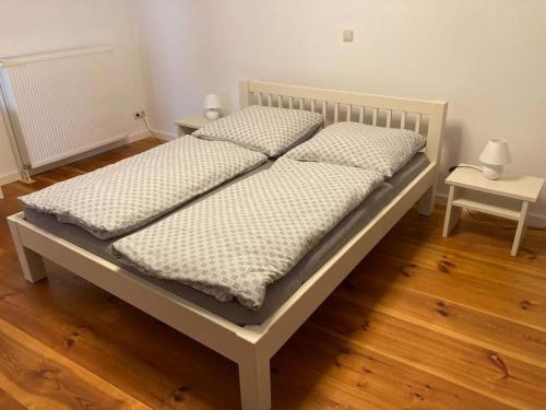 מיטה או מיטות בחדר ב-Alte Seifensiederei 3