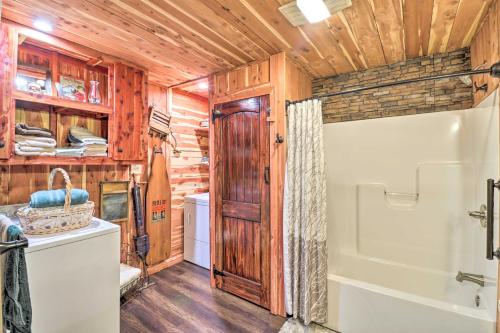 a bathroom with a shower and a sink and a toilet at Quiet, Historic Manor Located in Ghost Town! in Calico Rock