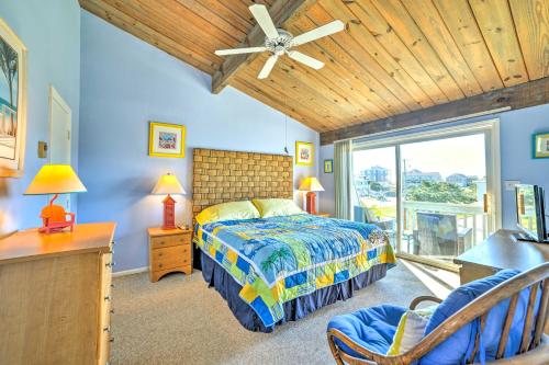 a bedroom with blue walls and a bed and a window at Coastal Atlantic Beach Duplex Less Than 1 Mi to Boardwalk! in Atlantic Beach