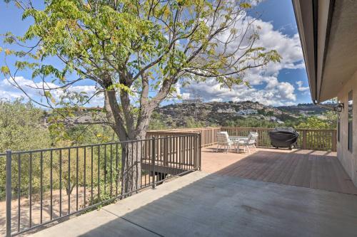 a deck with a tree and chairs on it at Hilltop Hideaway in Temecula Wine Country in Sage