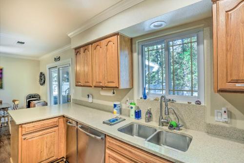 a kitchen with a sink and a window at Charming Shasta Lake Retreat Boat, Hike and Fish! in Lakehead