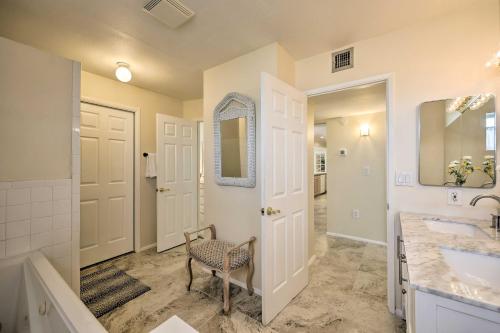 a bathroom with a sink and a mirror at Quiet Sun City Home with Grill - Golf and Hike Nearby! in Sun City