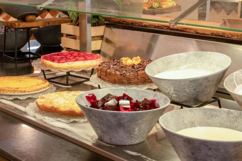 a display of cakes and pies in a bakery at Sol Palmanova Mallorca in Palmanova