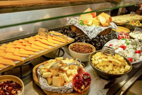 a buffet filled with lots of cheese and other foods at Sol Palmanova Mallorca in Palmanova