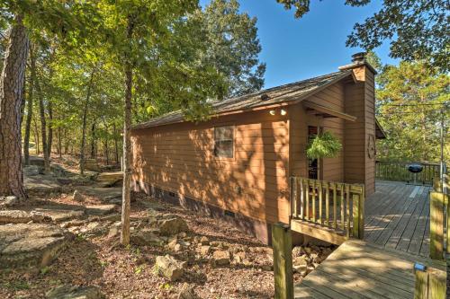 a cabin in the woods with a deck at Mountain View Cabin with Wraparound Deck! in Mountain View