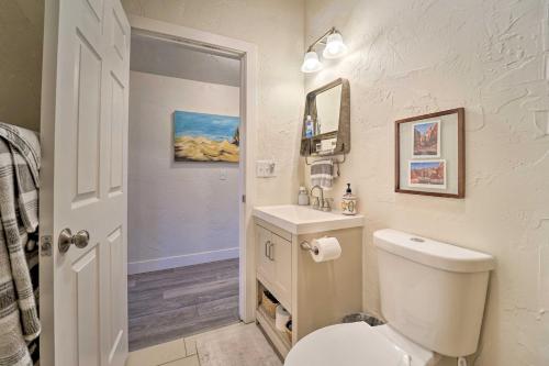 a bathroom with a white toilet and a sink at Studio with Mountain Views, Less Than 30 Min to Durango! in Mancos
