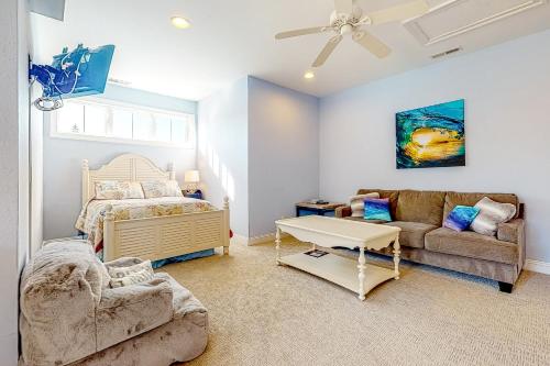 a bedroom with a bed and a couch at Bayside Resort --- 36288 Sunflower Blvd in Selbyville