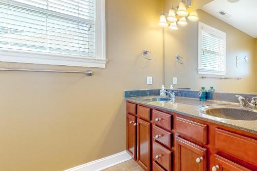 a bathroom with a double sink and a mirror at Bayside Resort --- 36288 Sunflower Blvd in Selbyville
