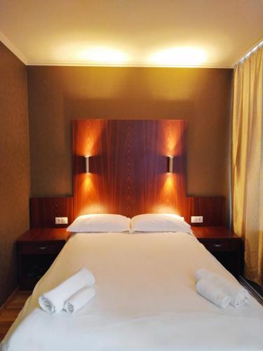 Ένα ή περισσότερα κρεβάτια σε δωμάτιο στο Milky Way Hotel