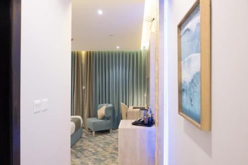 a view of a waiting room with a table and chairs at شقق واي سويت للشقق المخدومة in Abha