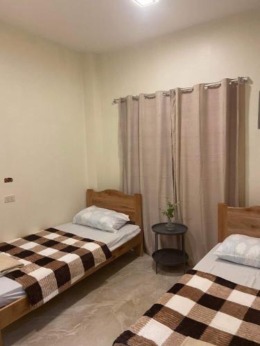 Postel nebo postele na pokoji v ubytování Antelmi Travelers Inn