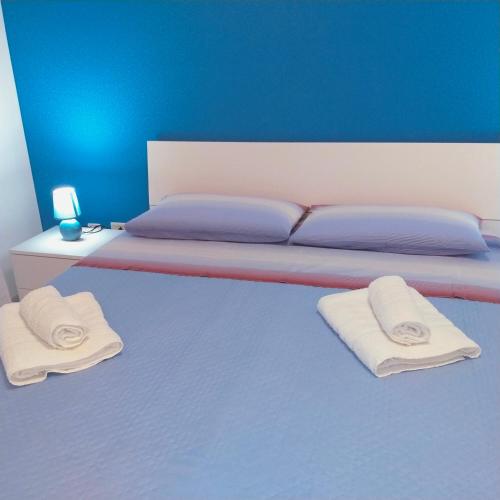 Letto o letti in una camera di casa vacanza Rosariomaria