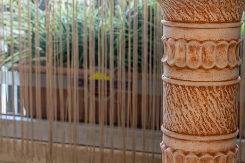 a pole in front of a bird cage at Residence Hotel By Ketenci in Izmir