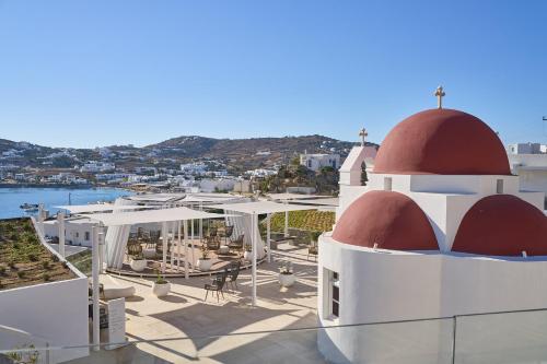 a building with a red dome on top of it at Once in Mykonos - Designed for Adults in Ornos
