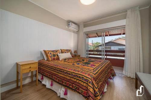 Ένα ή περισσότερα κρεβάτια σε δωμάτιο στο Casa com 02 dormitórios e jacuzzi aquecida