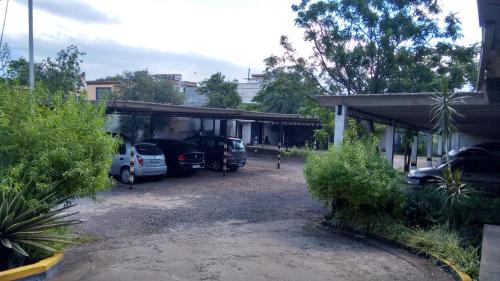 a parking lot with cars parked in a garage at River Hotel in Uruguaiana